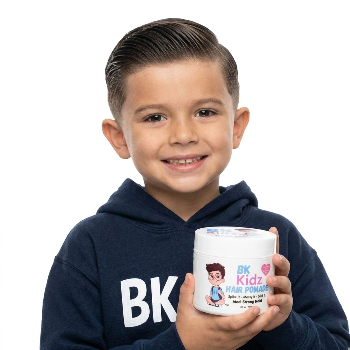 Child holding a container of BK Kidz hair pomade against a white background