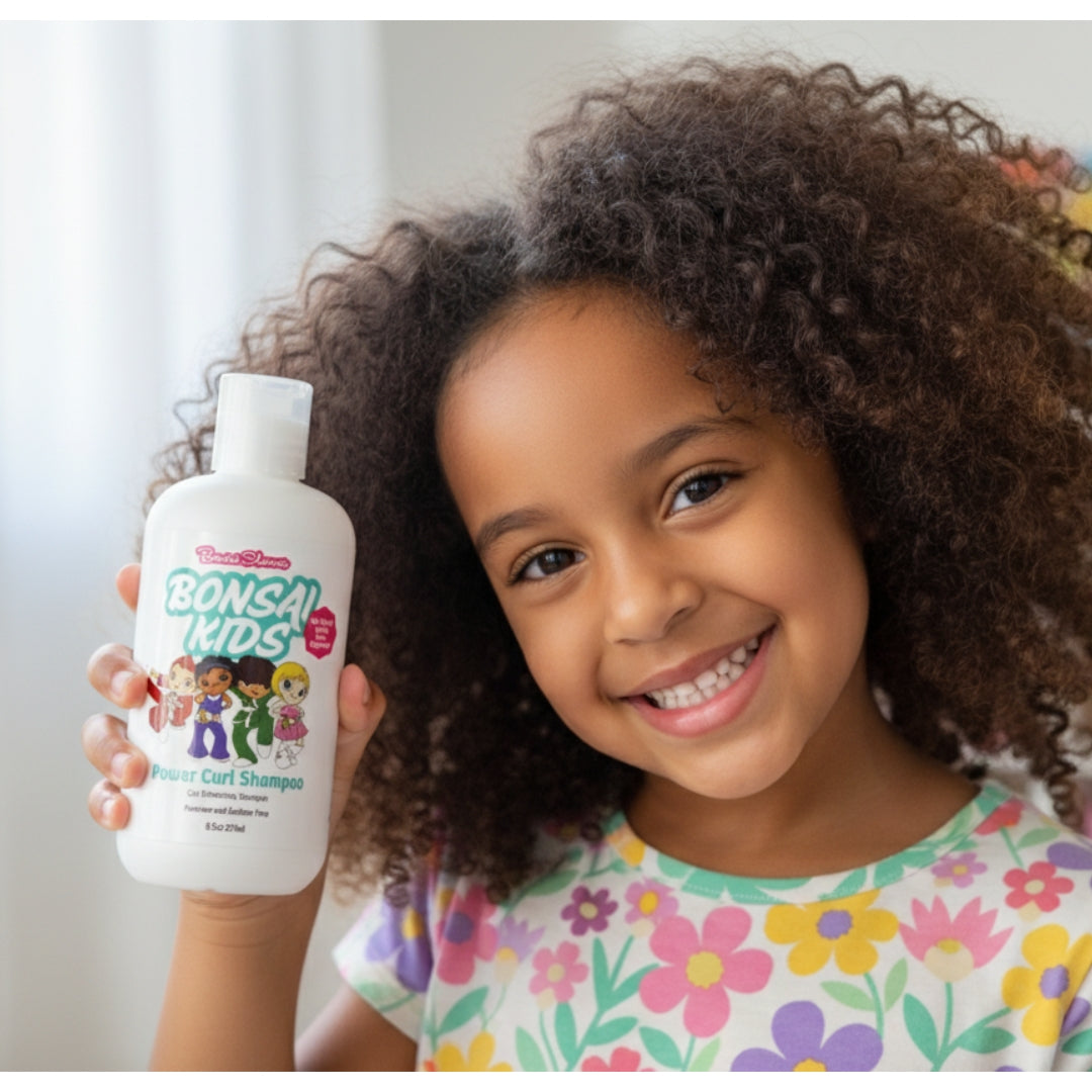 Child holding a bottle of Bounce Kids shampoo with a white background